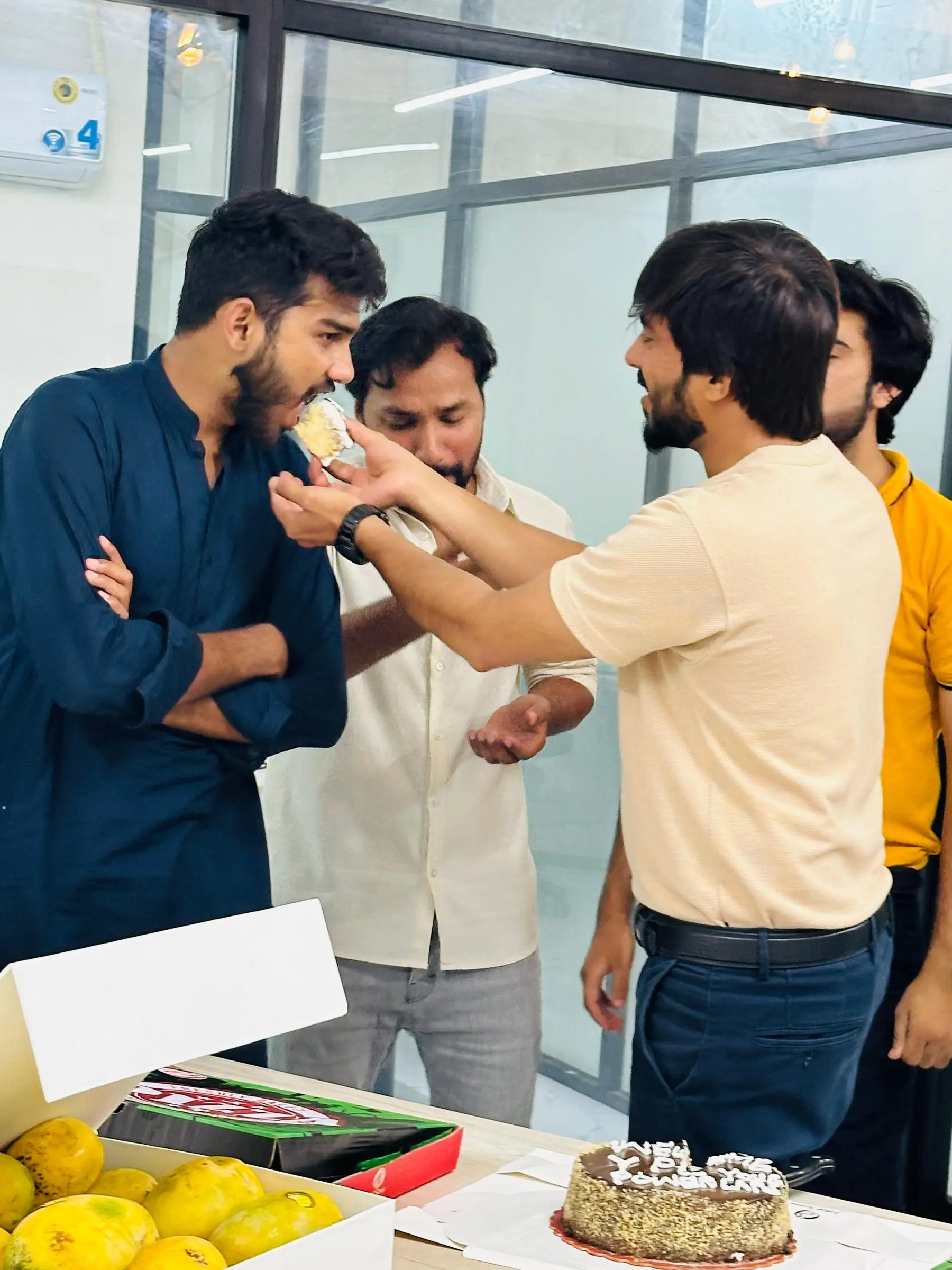 Colleagues celebrating in the office
