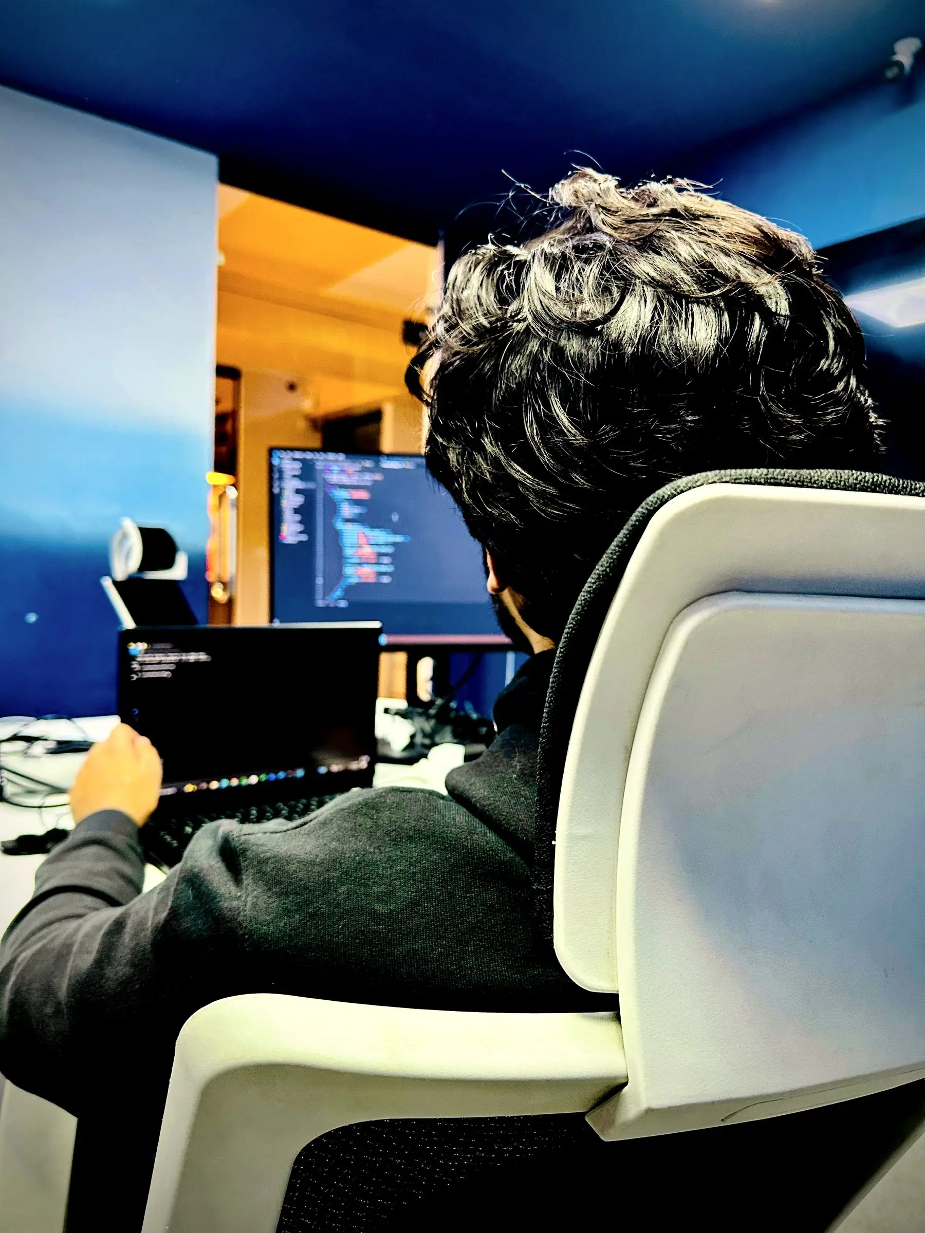 An engineer coding at his workstation