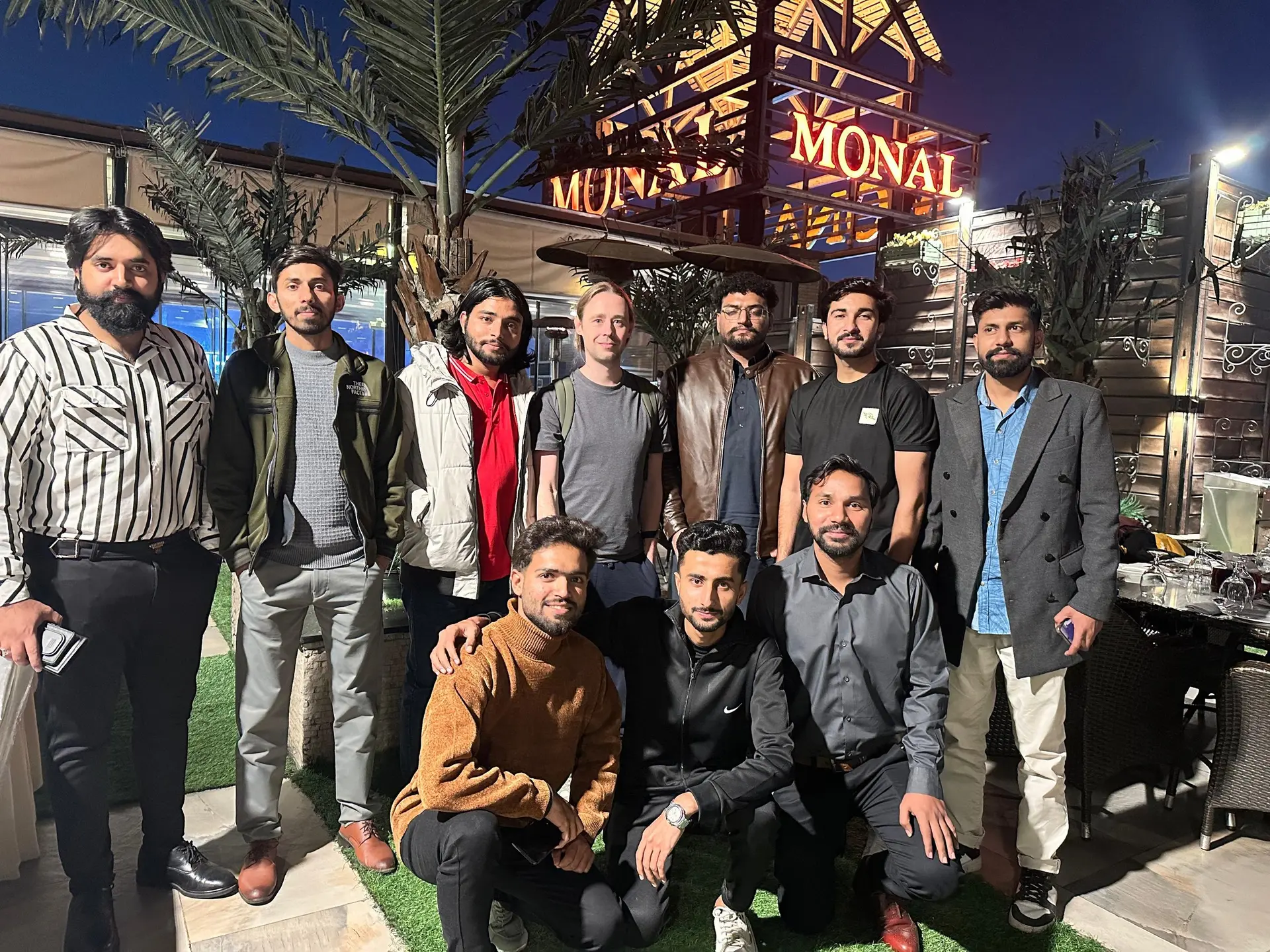 The team at a dinner at Monal