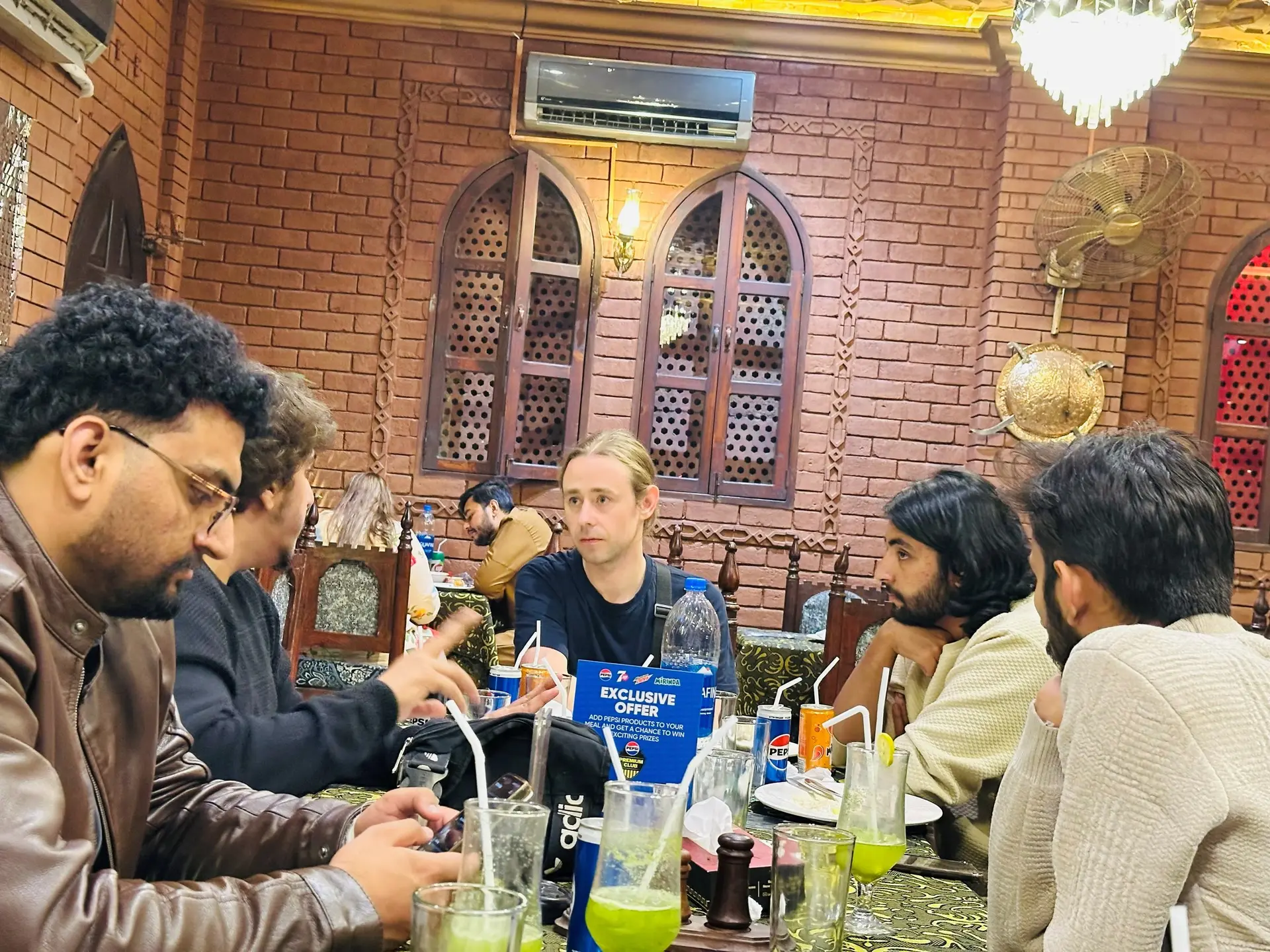 Team members talking over dinner