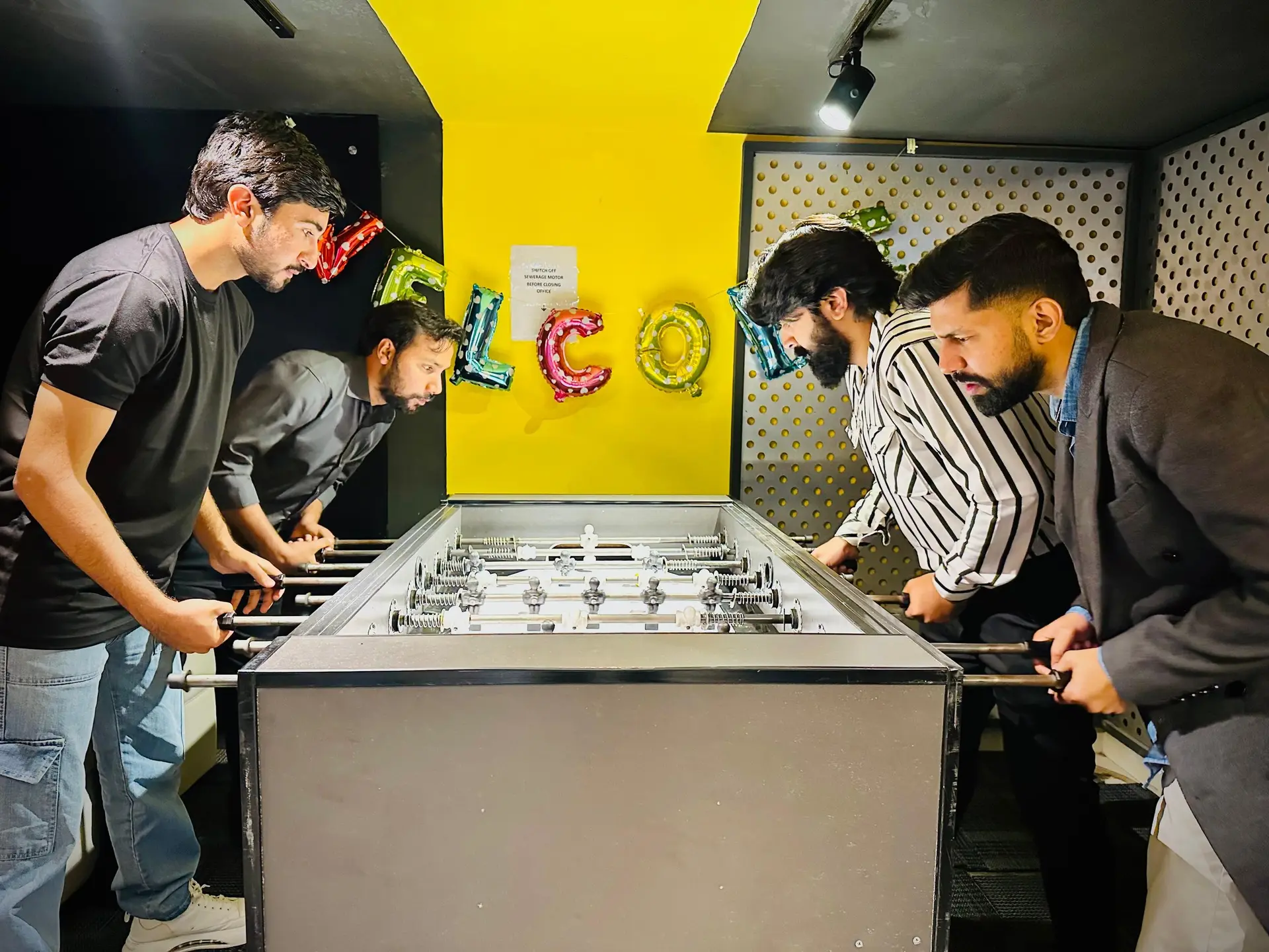 The team around the foosball table