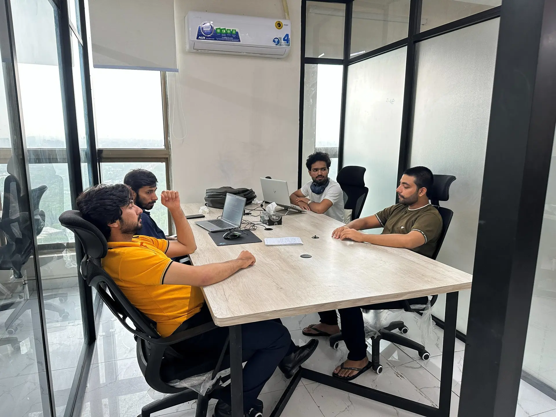 A small team meeting around a table
